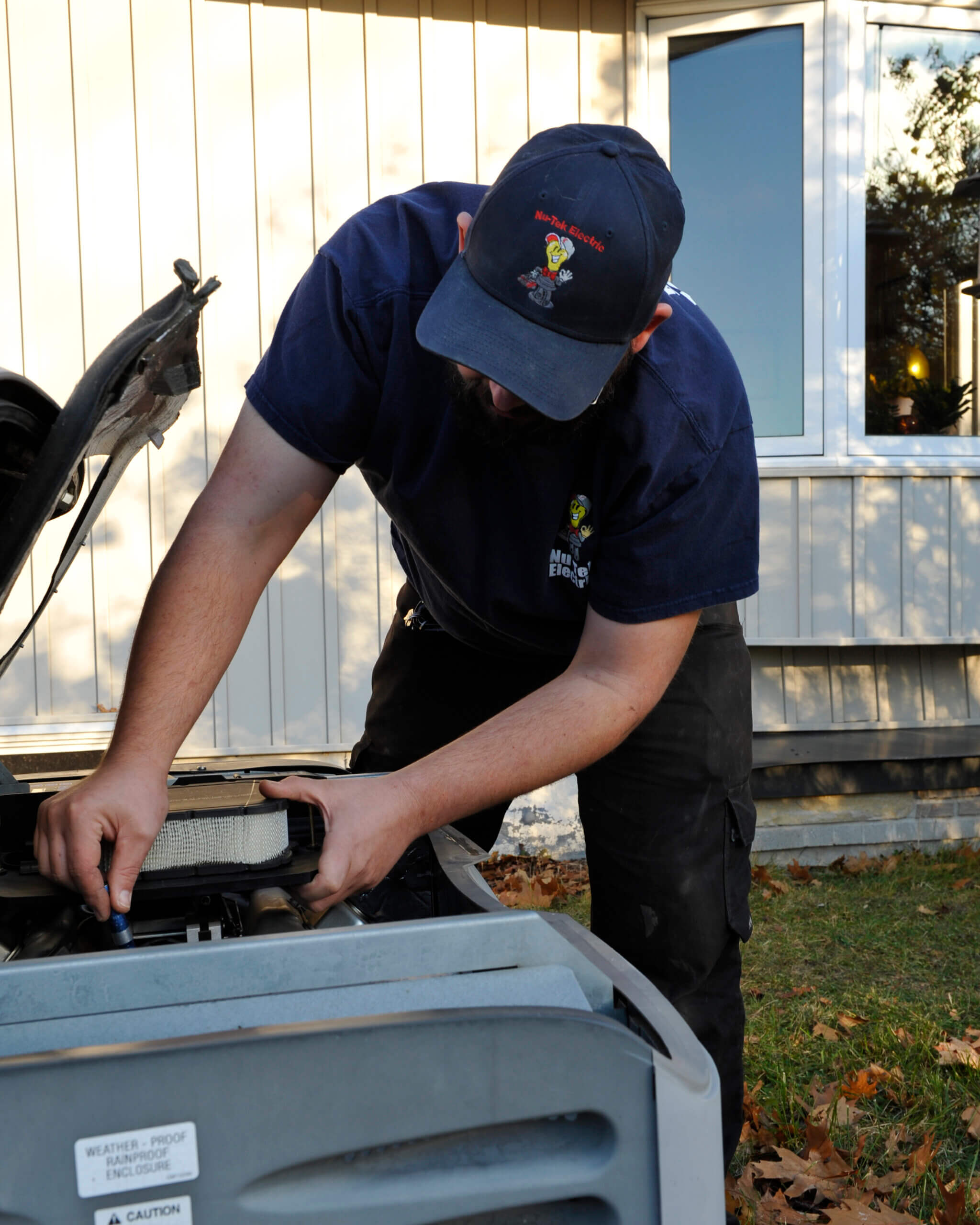Nu Tek Electrician Working On Generator